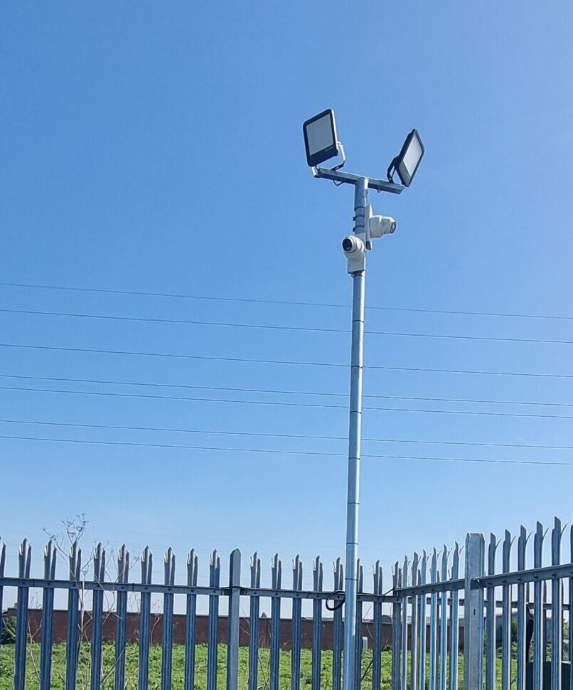 Hikvision CCTV cameras mounted on a security pole to monitor the perimeter and corner area of a commercial storage yard.Hikvision CCTV cameras mounted on a security pole to monitor the perimeter and corner area of a commercial storage yard.