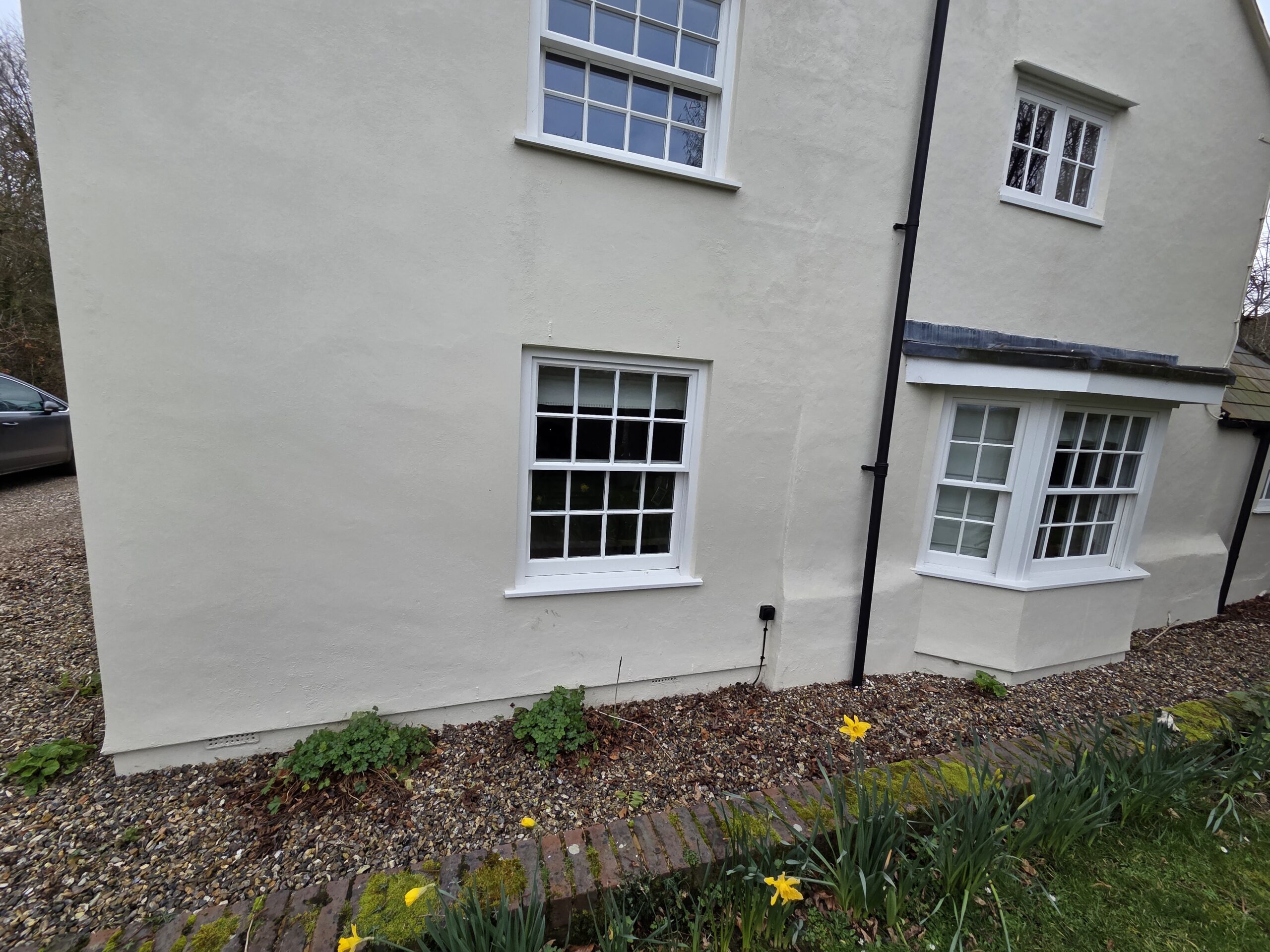 Cable routing on the exterior wall of a residential property as part of a home CCTV installation.